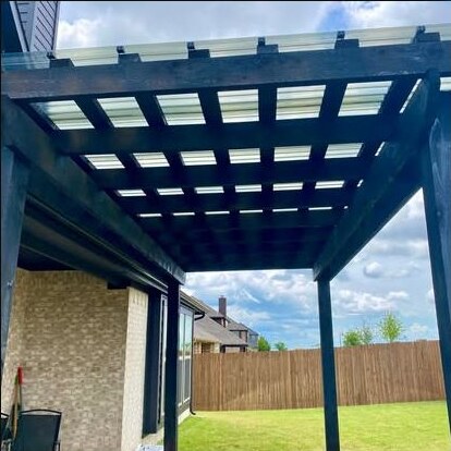 Covered wood pergola built by First Garden Landscaping