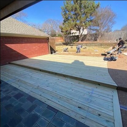 Custom backyard deck construction by First Garden Landscaping