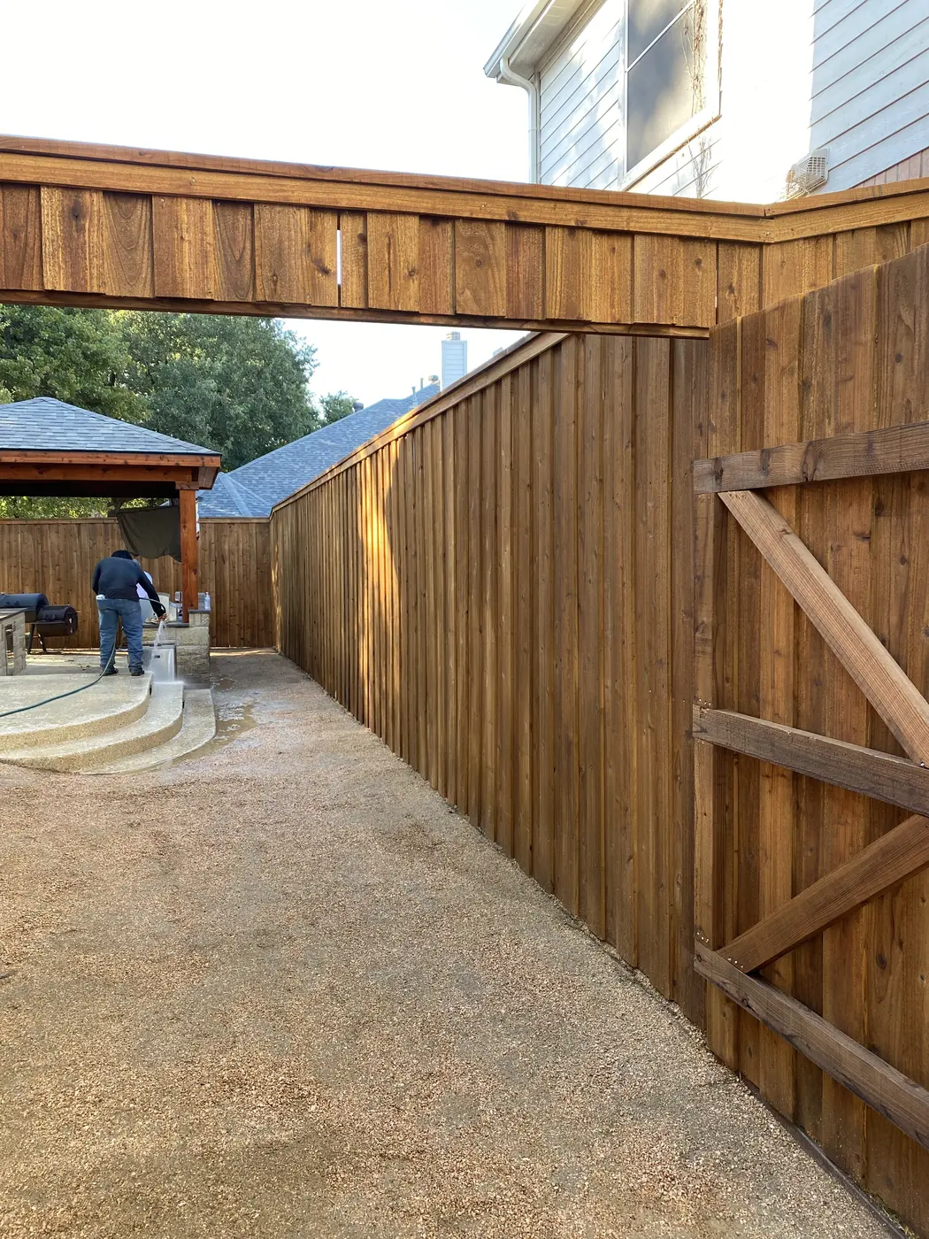 New wood privacy fence along a residential side yard
