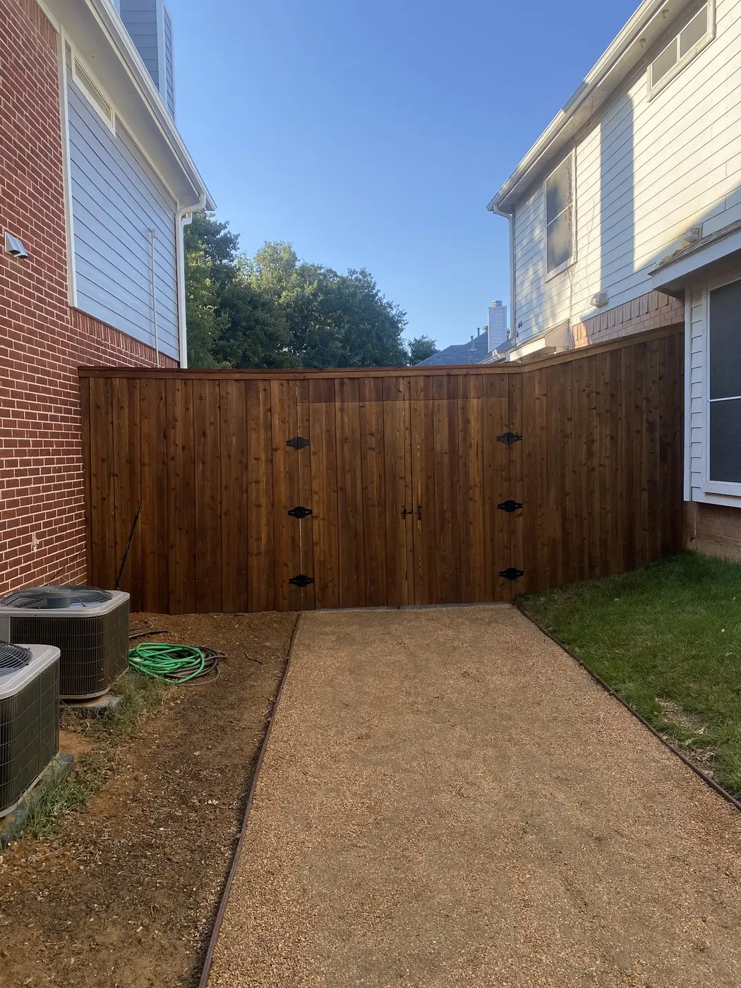 Finished wood privacy fence and gate installation