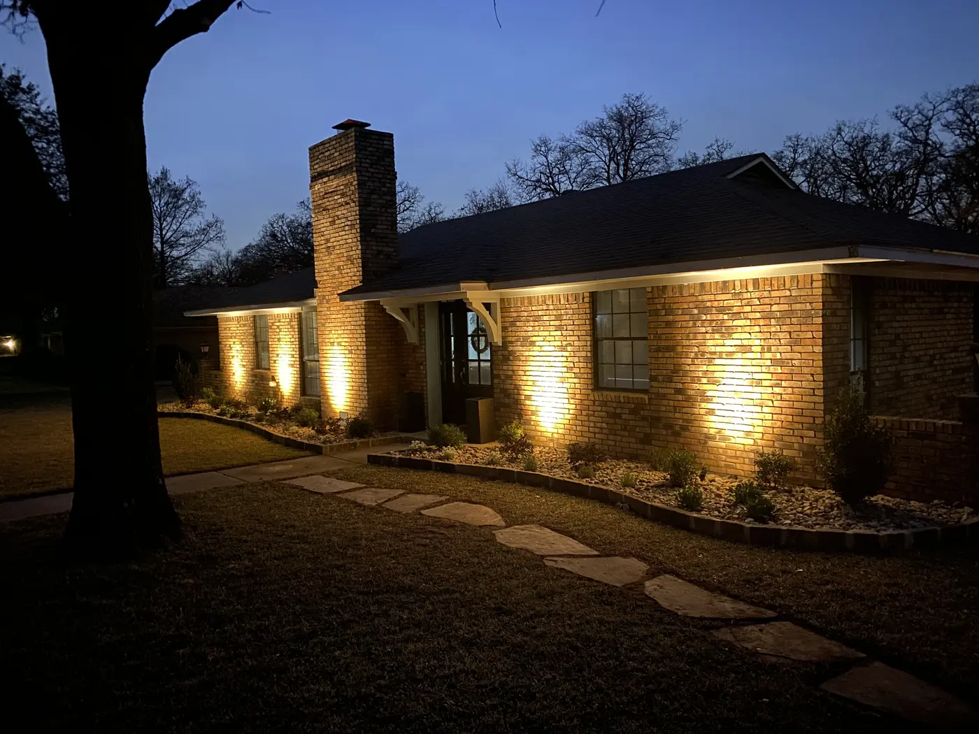Outdoor lighting around a pool and residential landscape