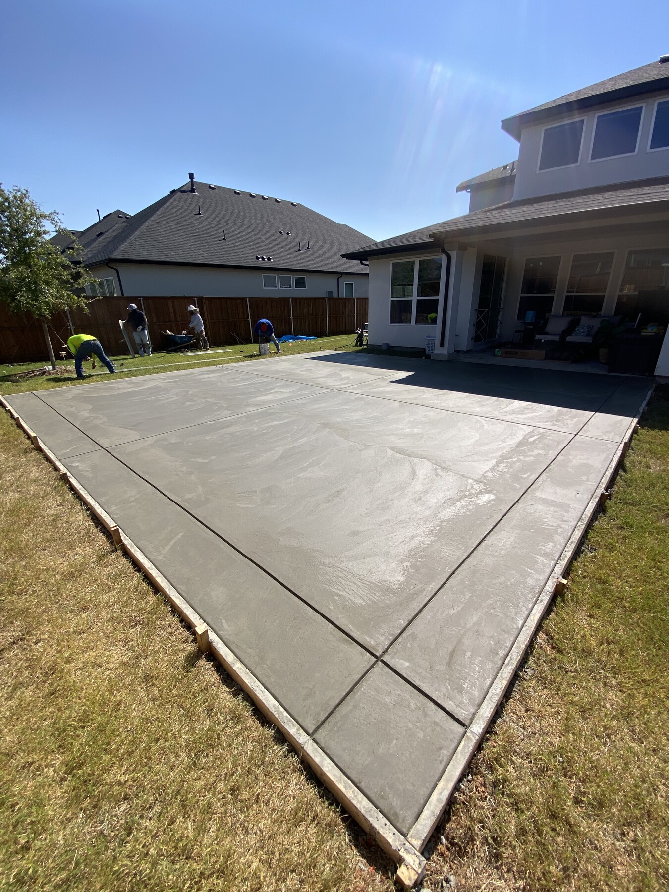 New residential concrete patio with control joints