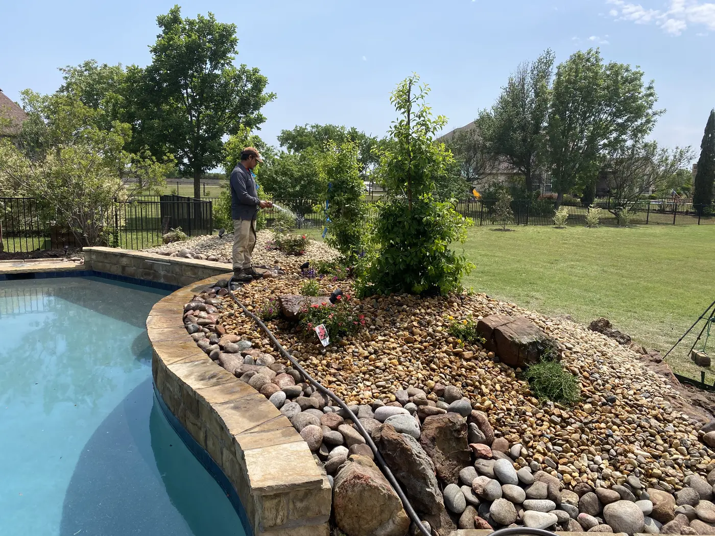 Fresh mulch and rock beds around a residential landscape
