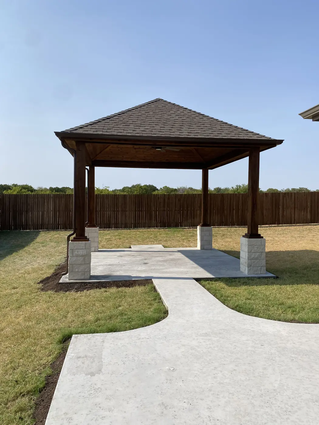 Freestanding covered pergola on a concrete patio