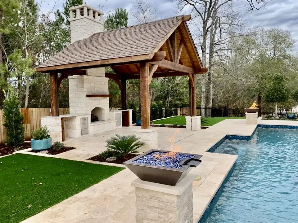 Finished wood patio cover beside a swimming pool