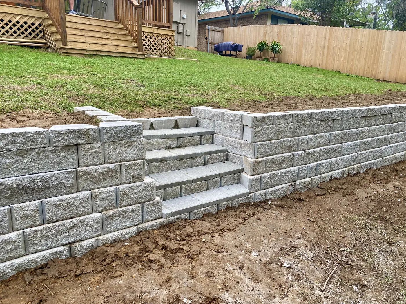Segmental block retaining wall under construction
